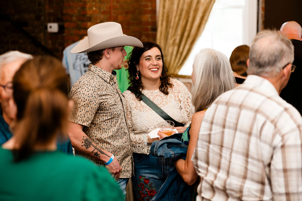 Guests mingling in the Franklin Theatre lobby before the show