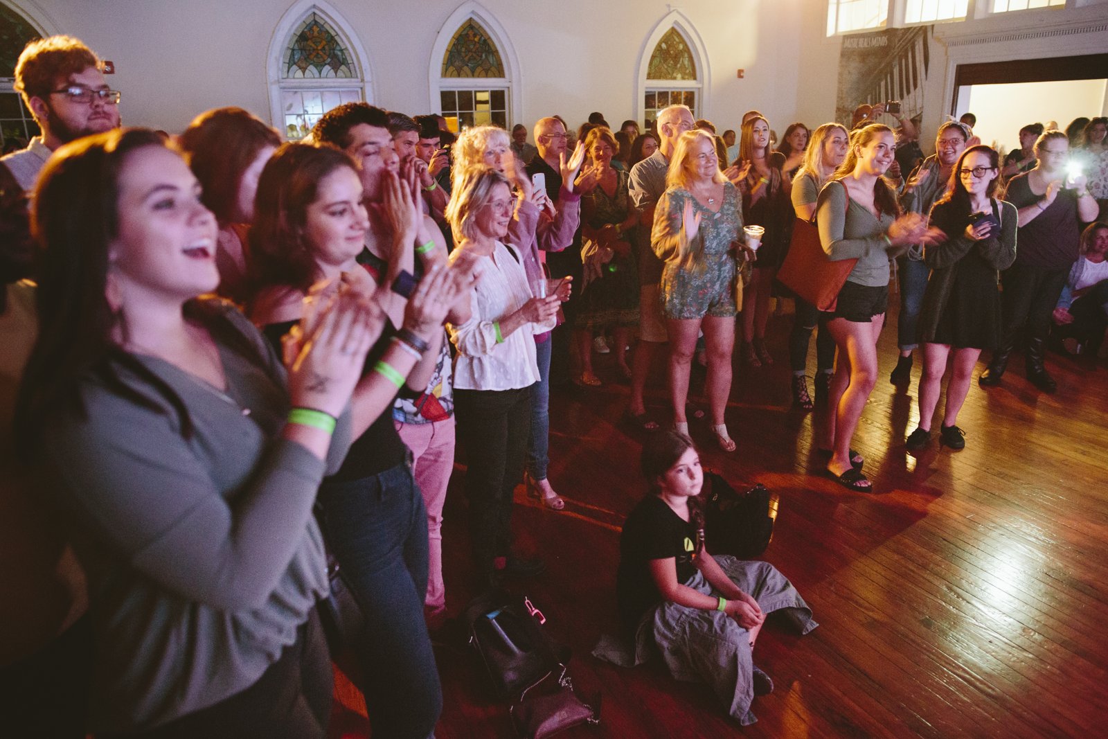 Audience gathered at the Sunny Day launch party, watching the stage