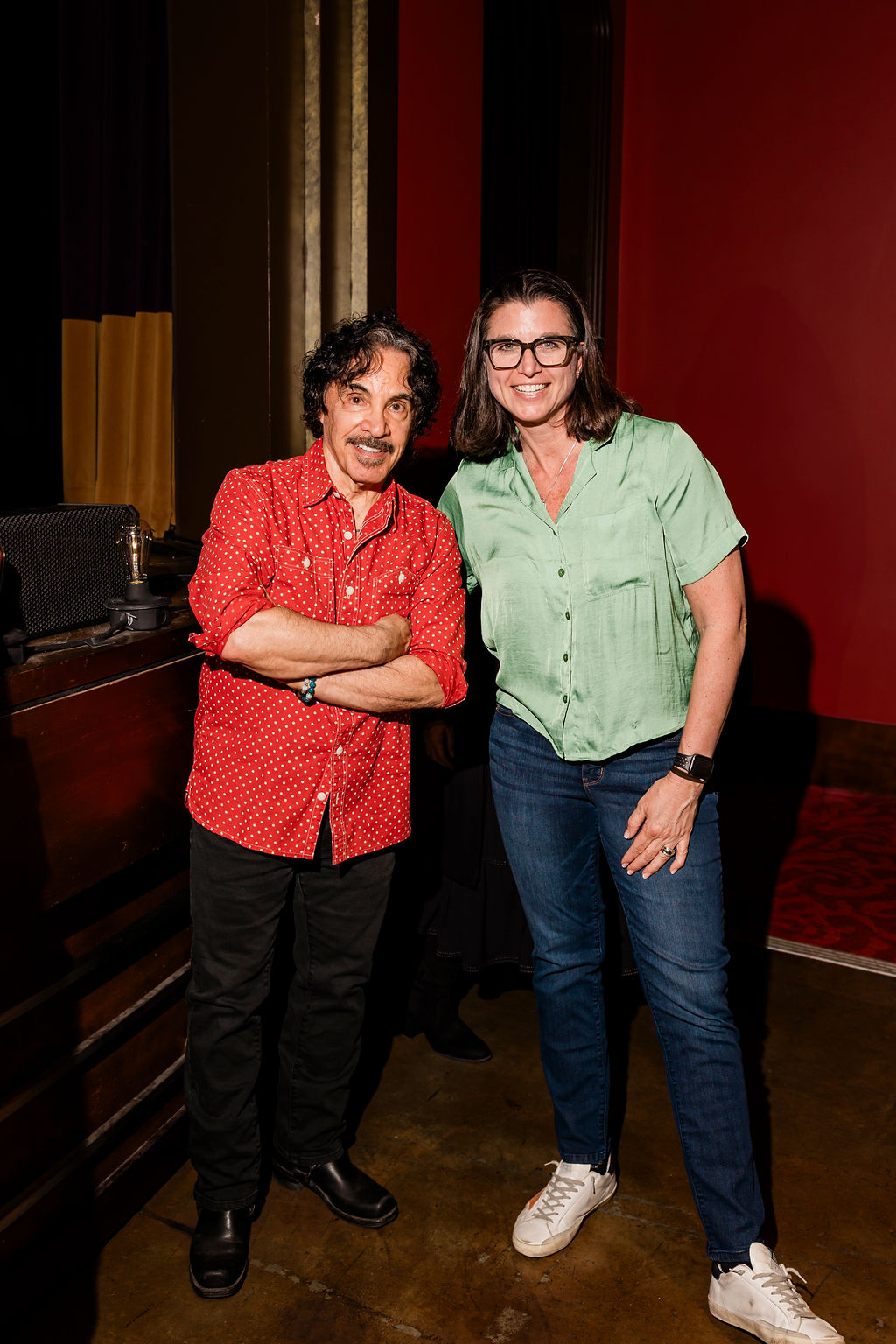 Two people standing together in the Franklin Theatre green room